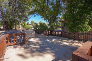 Charming house nestled among mature trees on a quiet street on Canyon Mesa Country Club in Arizona - for sale on GolfHomes.com, golf home, golf lot
