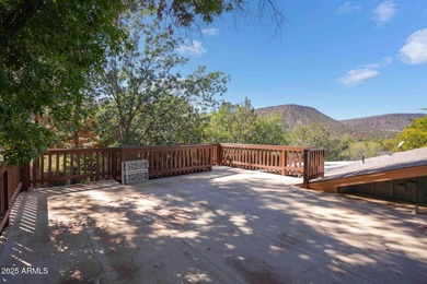 Charming house nestled among mature trees on a quiet street on Canyon Mesa Country Club in Arizona - for sale on GolfHomes.com, golf home, golf lot