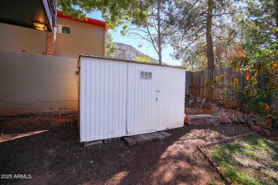 Charming house nestled among mature trees on a quiet street on Canyon Mesa Country Club in Arizona - for sale on GolfHomes.com, golf home, golf lot