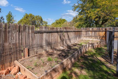 Charming house nestled among mature trees on a quiet street on Canyon Mesa Country Club in Arizona - for sale on GolfHomes.com, golf home, golf lot