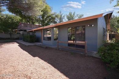 Charming house nestled among mature trees on a quiet street on Canyon Mesa Country Club in Arizona - for sale on GolfHomes.com, golf home, golf lot
