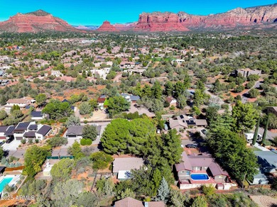 Charming house nestled among mature trees on a quiet street on Canyon Mesa Country Club in Arizona - for sale on GolfHomes.com, golf home, golf lot