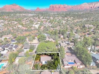 Charming house nestled among mature trees on a quiet street on Canyon Mesa Country Club in Arizona - for sale on GolfHomes.com, golf home, golf lot