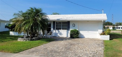 Waterfront GEM! This Mainlands home offers 2 bedrooms, 1 on Mainlands Golf Club in Florida - for sale on GolfHomes.com, golf home, golf lot