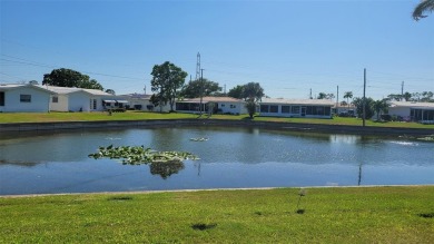 Waterfront GEM! This Mainlands home offers 2 bedrooms, 1 on Mainlands Golf Club in Florida - for sale on GolfHomes.com, golf home, golf lot