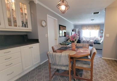 Waterfront GEM! This Mainlands home offers 2 bedrooms, 1 on Mainlands Golf Club in Florida - for sale on GolfHomes.com, golf home, golf lot