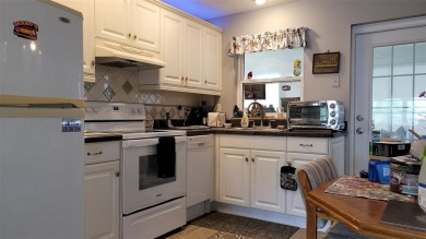 Waterfront GEM! This Mainlands home offers 2 bedrooms, 1 on Mainlands Golf Club in Florida - for sale on GolfHomes.com, golf home, golf lot