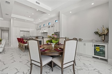 Step into this stunning custom residence by Gulfshore Homes, set on Miromar Lakes Golf Club in Florida - for sale on GolfHomes.com, golf home, golf lot