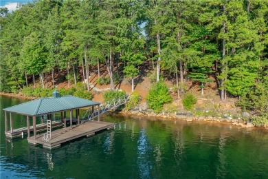 Set along the shores of a calm, emerald-green Lake Keowee Cove on The Cliffs At Keowee Falls in South Carolina - for sale on GolfHomes.com, golf home, golf lot