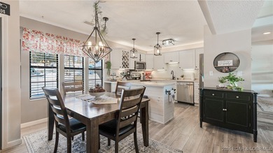 Beautifully updated waterfront condominium with stunning lake on Seasons Ridge At Four Seasons in Missouri - for sale on GolfHomes.com, golf home, golf lot