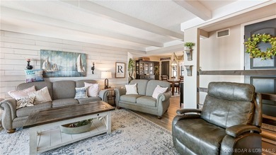 Beautifully updated waterfront condominium with stunning lake on Seasons Ridge At Four Seasons in Missouri - for sale on GolfHomes.com, golf home, golf lot