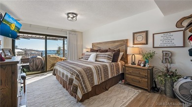Beautifully updated waterfront condominium with stunning lake on Seasons Ridge At Four Seasons in Missouri - for sale on GolfHomes.com, golf home, golf lot