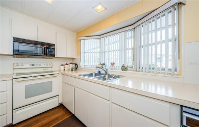 Come view this beautifully furnished two-bedroom, two-bath with on Palm Hill Golf Club in Florida - for sale on GolfHomes.com, golf home, golf lot