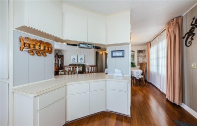 Come view this beautifully furnished two-bedroom, two-bath with on Palm Hill Golf Club in Florida - for sale on GolfHomes.com, golf home, golf lot