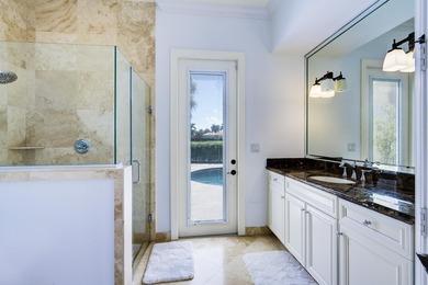 Live luxuriously on the 16th green of the Arnold Palmer on Frenchmans Reserve in Florida - for sale on GolfHomes.com, golf home, golf lot