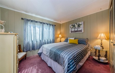 Come view this beautifully furnished two-bedroom, two-bath with on Palm Hill Golf Club in Florida - for sale on GolfHomes.com, golf home, golf lot