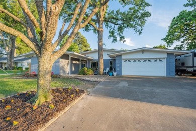 Nestled in the highly sought-after gated community of Hideaway on Hide-A-Way Lake Golf Course in Texas - for sale on GolfHomes.com, golf home, golf lot