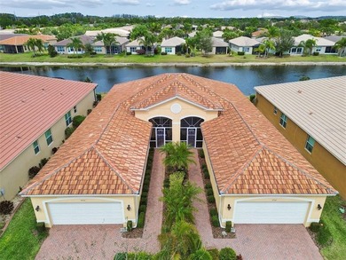 An opportunity to own a Nantucket model villa with a water view on Caloosa Greens Executive Golf Course in Florida - for sale on GolfHomes.com, golf home, golf lot