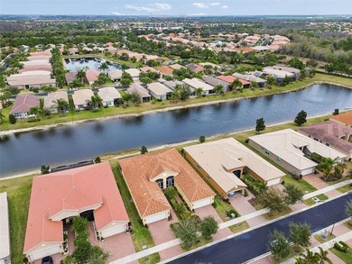 An opportunity to own a Nantucket model villa with a water view on Caloosa Greens Executive Golf Course in Florida - for sale on GolfHomes.com, golf home, golf lot