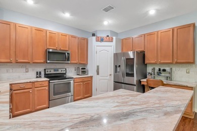 Experience the ideal combination of elegance, comfort, and on Heritage Harbor Golf and Country Club in Florida - for sale on GolfHomes.com, golf home, golf lot