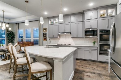Step into refined luxury with this exquisite one-story residence on The Tribute At the Colony in Texas - for sale on GolfHomes.com, golf home, golf lot
