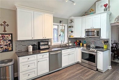 This modern ranch cluster home set on the 10th fairway has on  in Ohio - for sale on GolfHomes.com, golf home, golf lot