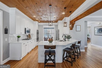 This stunning luxury home at 4027 Hickory Fairway Drive on The Golf Club At Bradshaw Farm in Georgia - for sale on GolfHomes.com, golf home, golf lot