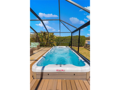 *COMPLETE PRIVACY* FANTASTIC TRAVERTINE LANAI *WATER VIEWS * on Bella Glade Country Club in Florida - for sale on GolfHomes.com, golf home, golf lot