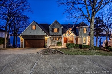Timeless Tudor elegance meets effortless lake living in this on The Club At Porto Cima in Missouri - for sale on GolfHomes.com, golf home, golf lot