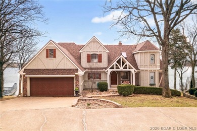 Timeless Tudor elegance meets effortless lake living in this on The Club At Porto Cima in Missouri - for sale on GolfHomes.com, golf home, golf lot