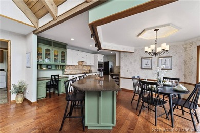 Timeless Tudor elegance meets effortless lake living in this on The Club At Porto Cima in Missouri - for sale on GolfHomes.com, golf home, golf lot