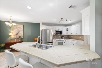 You'll fall in love with this Creole cottage-style home nestled on Isle Dauphine Club Golf Course in Alabama - for sale on GolfHomes.com, golf home, golf lot
