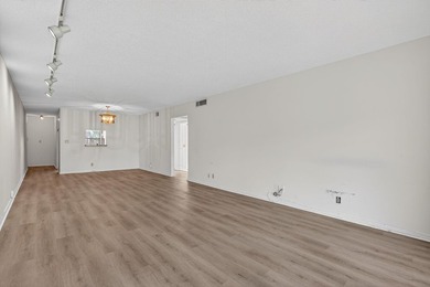 ASSOC REQUIRES 20% DOWN & 1 OCCUP 55+ VACANT/CLICK ON SHOWING on Wynmoor Golf Course in Florida - for sale on GolfHomes.com, golf home, golf lot