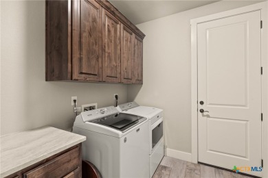 Discover the perfect blend of elegance and modern comfort in on Mill Creek Golf Club in Texas - for sale on GolfHomes.com, golf home, golf lot