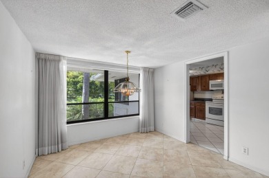 Nestled in the exclusive Quail Ridge Country Club, this 3-bed on Quail Ridge Golf Course and Country Club in Florida - for sale on GolfHomes.com, golf home, golf lot