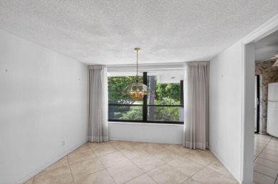 Nestled in the exclusive Quail Ridge Country Club, this 3-bed on Quail Ridge Golf Course and Country Club in Florida - for sale on GolfHomes.com, golf home, golf lot