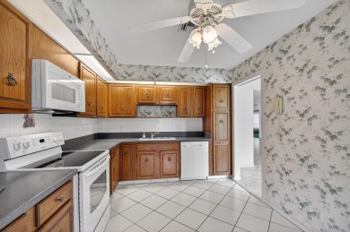 Nestled in the exclusive Quail Ridge Country Club, this 3-bed on Quail Ridge Golf Course and Country Club in Florida - for sale on GolfHomes.com, golf home, golf lot