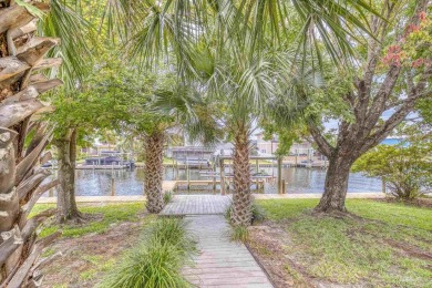 Welcome to waterfront living in the highly sought-after Santa on Tiger Point Golf and Country Club in Florida - for sale on GolfHomes.com, golf home, golf lot