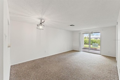 One or more photo(s) has been virtually staged. Located within on Seven Springs Golf and Country Club in Florida - for sale on GolfHomes.com, golf home, golf lot