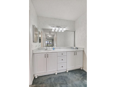 Nestled in the exclusive Quail Ridge Country Club, this 3-bed on Quail Ridge Golf Course and Country Club in Florida - for sale on GolfHomes.com, golf home, golf lot