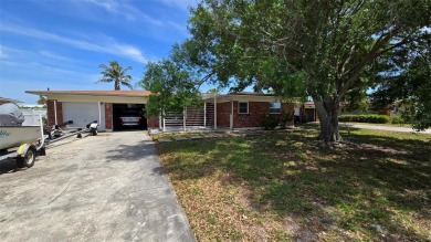This home is located in Dana Shores - a very popular waterfront on Rocky Point Golf Course in Florida - for sale on GolfHomes.com, golf home, golf lot