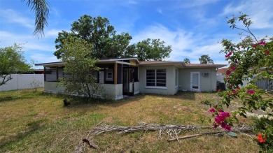 This home is located in Dana Shores - a very popular waterfront on Rocky Point Golf Course in Florida - for sale on GolfHomes.com, golf home, golf lot