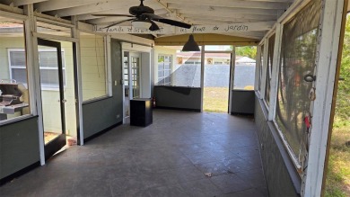 This home is located in Dana Shores - a very popular waterfront on Rocky Point Golf Course in Florida - for sale on GolfHomes.com, golf home, golf lot