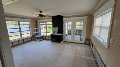 This home is located in Dana Shores - a very popular waterfront on Rocky Point Golf Course in Florida - for sale on GolfHomes.com, golf home, golf lot
