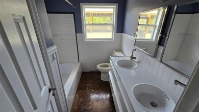 This home is located in Dana Shores - a very popular waterfront on Rocky Point Golf Course in Florida - for sale on GolfHomes.com, golf home, golf lot