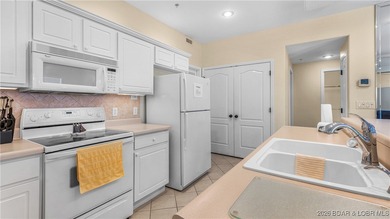 Wow! What a View! Ride the elevator to a SUPER CLEAN lakefront on Tan-Tar-A Golf Club in Missouri - for sale on GolfHomes.com, golf home, golf lot