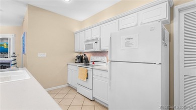 Wow! What a View! Ride the elevator to a SUPER CLEAN lakefront on Tan-Tar-A Golf Club in Missouri - for sale on GolfHomes.com, golf home, golf lot