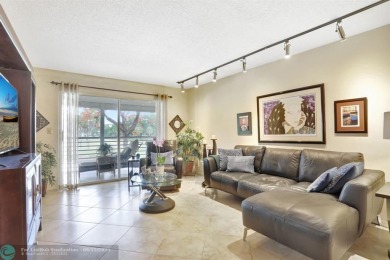 WELL CARED FOR 2/2 ON THE GOLF COURSE W/ LOVELY LAKE VIEW! on Wynmoor Golf Course in Florida - for sale on GolfHomes.com, golf home, golf lot