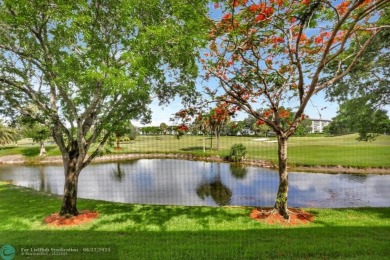 WELL CARED FOR 2/2 ON THE GOLF COURSE W/ LOVELY LAKE VIEW! on Wynmoor Golf Course in Florida - for sale on GolfHomes.com, golf home, golf lot