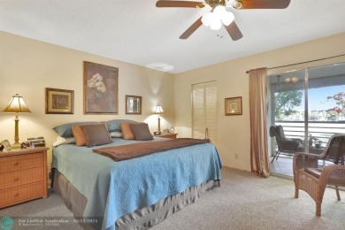 WELL CARED FOR 2/2 ON THE GOLF COURSE W/ LOVELY LAKE VIEW! on Wynmoor Golf Course in Florida - for sale on GolfHomes.com, golf home, golf lot